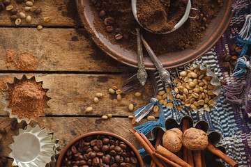 Roasted black and green coffee beans and ground coffee in the plate