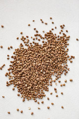 Pile of buckwheat isolated on white background. Top view.