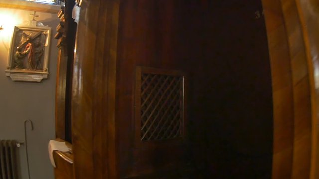 Walking to a Church Confessional Booth