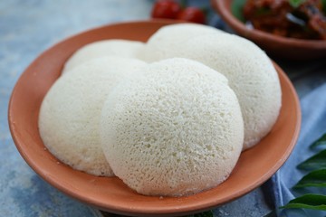 South Indian breakfast Idlis with Tomato chutney, selective focus