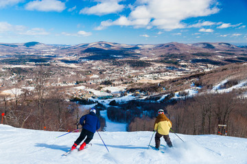 Overlooking the valley with skiers going downhill, Windham, New York, USA