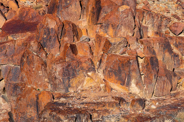 Red hematite from the formation of bound iron. Egypt. Mount Sinai in the morning at sunrise. Red-brown rocks in the mountains of the peninsula.	