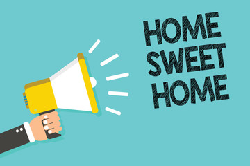 Writing note showing Home Sweet Home. Business photo showcasing In house finally Comfortable feeling Relaxed Family time Man holding megaphone loudspeaker blue background message speaking