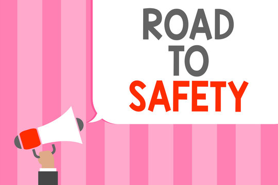 Conceptual hand writing showing Road To Safety. Business photo showcasing Secure travel protect yourself and others Warning Caution Man holding megaphone loudspeaker speech bubble message loud