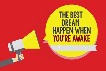 Conceptual hand writing showing The Best Dream Happen When You re are Awake. Business photo text Dreams come true Have to believe Man holding megaphone loudspeaker yellow bubble on red background