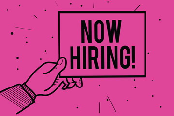 Conceptual hand writing showing Now Hiring. Business photo showcasing announcing that certain company seeking for new talents Man hand holding paper information dotted purple background