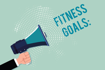 Handwriting text writing Fitness Goals. Concept meaning Loose fat Build muscle Getting stronger Conditioning.