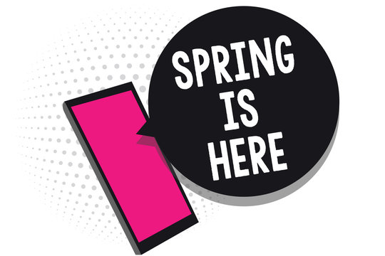 Text sign showing Spring Is Here. Conceptual photo After winter season has arrived Enjoy nature flowers sun Cell phone receiving text messages chats information using applications