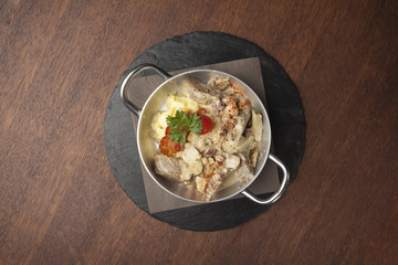 mashed potatoes with cooked pork and side dish