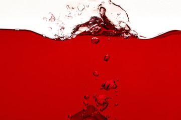 red liquid with splash and bubbles isolated on white - Powered by Adobe