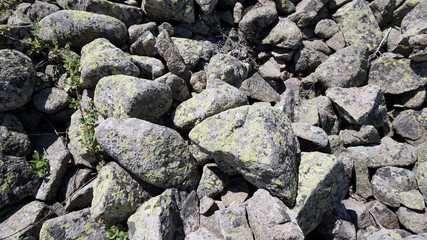 old rocks in nature  very old rock fragments with moss 