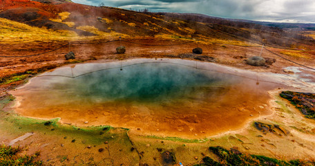 Fototapeta na wymiar Geysir National Park in Iceland has many thermal springs that look much like those found in Yellowstone