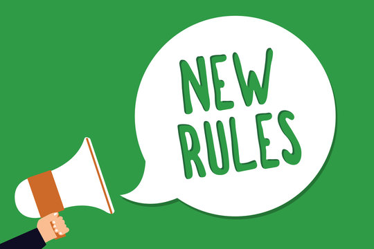 Conceptual hand writing showing New Rules. Business photo showcasing A state of changing an iplemented policy for better upgrade Man holding megaphone loudspeaker screaming green background