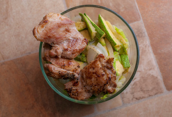 Fried chicken with cooked vegetables in a bowl