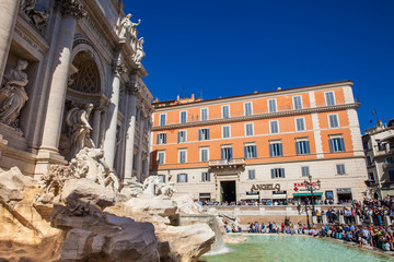 Fototapeta premium Tourists at the Trevi Fountain designed by Italian architect Nicola Salvi and completed by Giuseppe Pannini in 1762