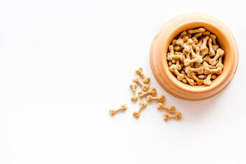 Dog dry food in bowl on white background top view mock-up