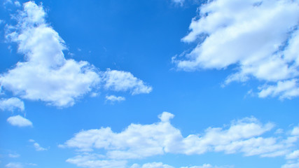 Naklejka na ściany i meble crisp blue sky with white clouds