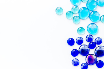 Glass stones for design and home creativity on white background top view space for text