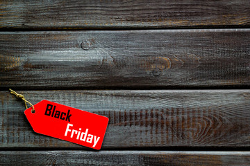 Discounts with black friday lable on wooden background top view space for text
