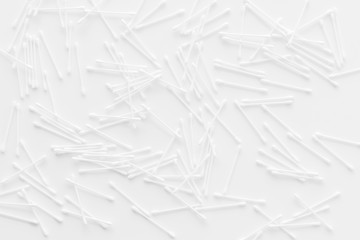 pattern of cosmetic cotton swabs on white background top view