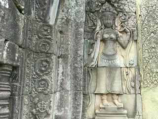 a beautiful devata bas relief carving at bayon temple