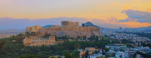 Parthenon temple in Acropolis Hill, Athens, Greece, shot in blue hour over old town during colorful...