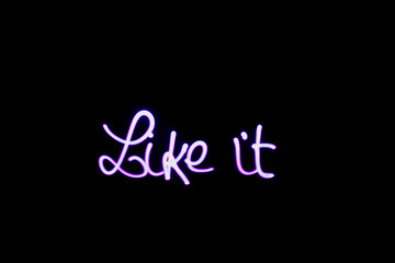 Words like it written with a led lamp during a lightpainting session at night. 