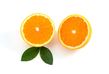 Citrus is a fruit that has high vitamin C, half cut orange, has a shadow and has leaves on a white background.
