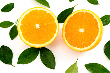Citrus is a fruit that has high vitamin C, half cut orange, has a shadow and has leaves on a white background.
