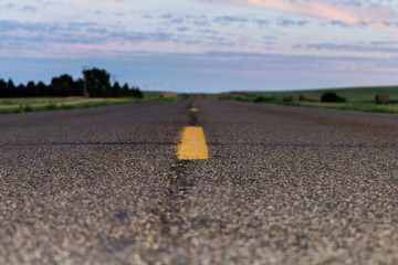 a north dakota highway at sunset