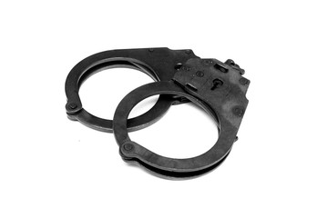 Black handcuffs isolated on the white background.