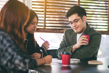 Group of businessman working and discussing about business data together in office