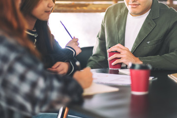 Group of businessman working and discussing about business data together in office