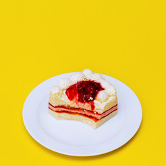 Cake on yellow background. Flat lay food vanilla candy art