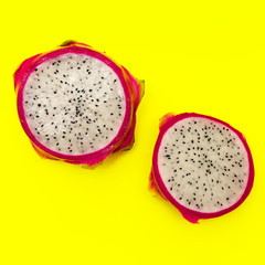 Pitahaya or dragon fruit on yellow background.Minimal exotic fruits concept