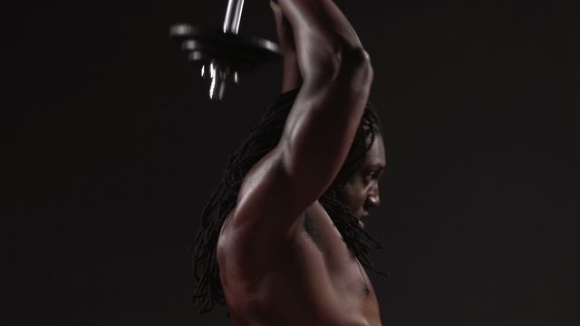 Weightlifting, slow motion shot of fit African American Man