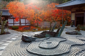 Autumn scenery of a Japanese rock garden ( zen garden, dry landscape, or karesansui ) in morning...