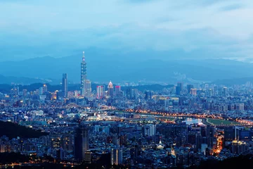 Fotobehang Sunset scenery of Downtown Taipei, vibrant capital city of Taiwan, with landmark  tower standing out amid high-rise buildings in Xinyi Financial District & colorful city lights dazzling in twilight © AaronPlayStation