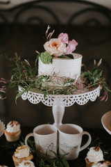 Small White Wedding Cake with flowers on top, peonies on wedding cake