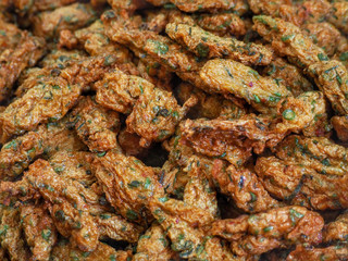 Many fried fish-paste balls are cooked it is looks are colorful and look delicious