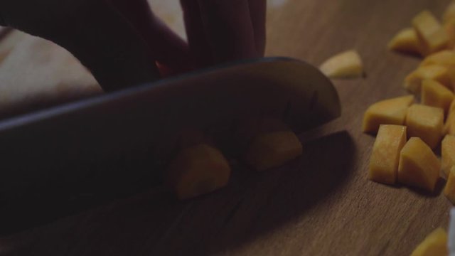Women's hands wash, peel and cut vegetables into vegetable stew.