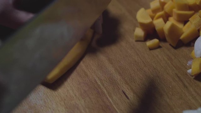 Women's hands wash, peel and cut vegetables into vegetable stew.