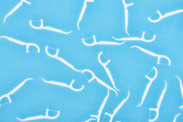 top view of white floss sticks isolated on blue