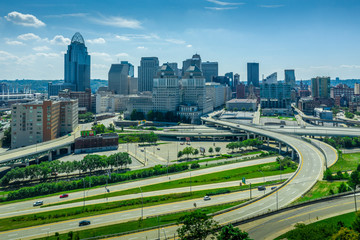 Aerial panoramic view of Cincinnati downtown from the east on a sunny afternoon with twisting highways and bridges