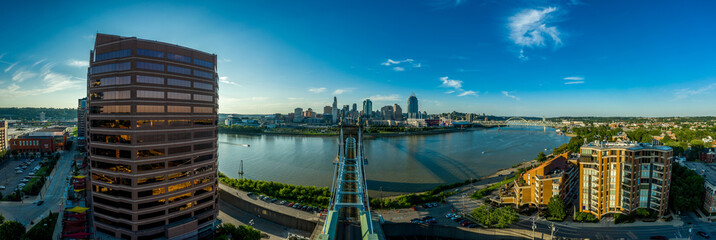 Panoramic view of Cincinnati downtown with the historic Roebling suspension bridge over the Ohio river