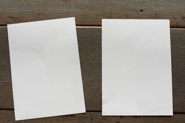 Woman holding paper blank of drawing paper paper with natural background.