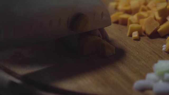Women's hands wash, peel and cut vegetables into vegetable stew.