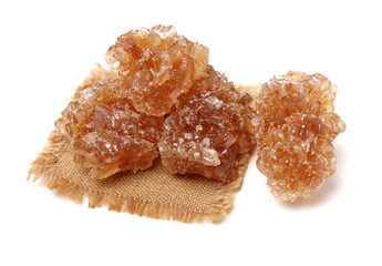 dark crystal sugar on white background