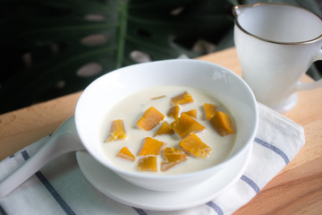 Thai dessert: Pumpkin in sweet coconut milk,  Coconut Milk Stewed Pumpkin bowl. (Buak Phak Tong)
