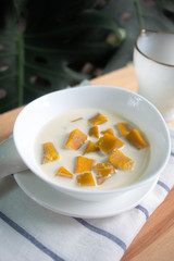 Thai dessert: Pumpkin in sweet coconut milk,  Coconut Milk Stewed Pumpkin bowl. (Buak Phak Tong)